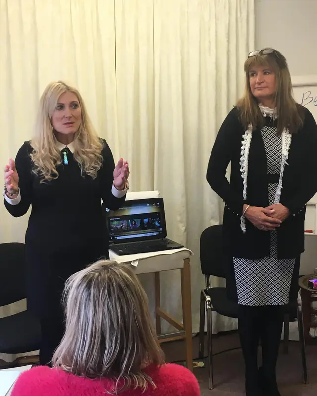 Sonya Hudson presenting at a workshop alongside a colleague
